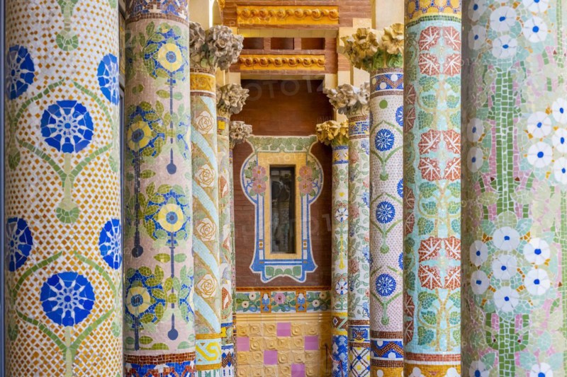 Columns with colourful mosaic on the outdoor terrace