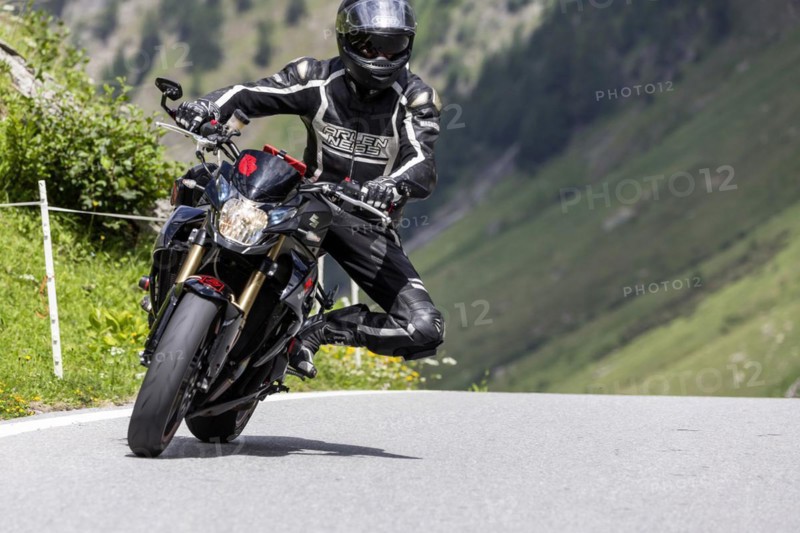 Motorbike on the winding Nufenen Pass in the Alps