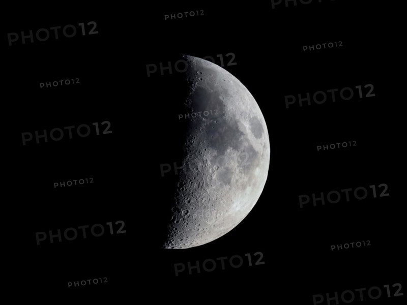 First quarter moon seen with an astronomical telescope
