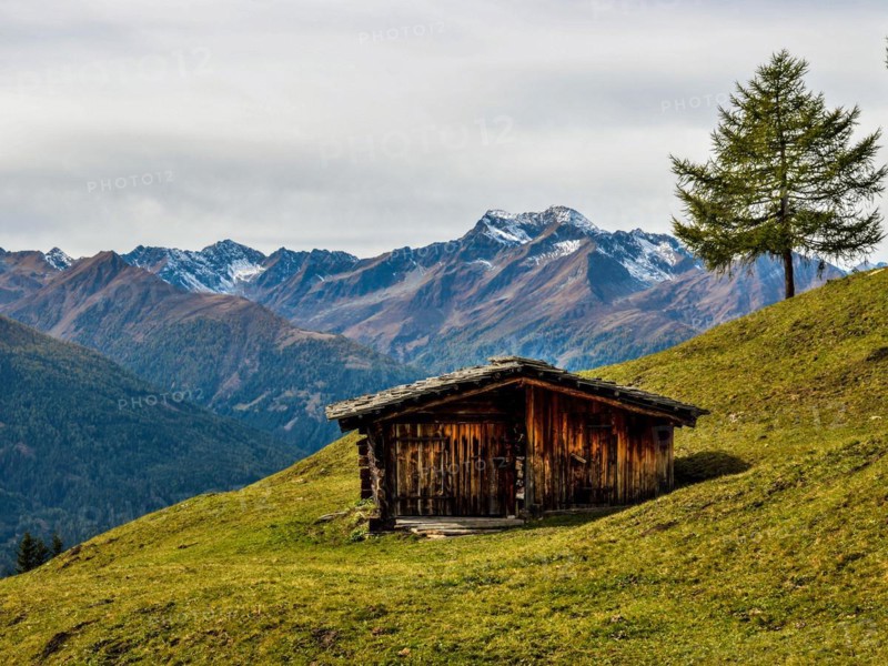 Hut on the mountain pasture in autumn with the Lasoerling