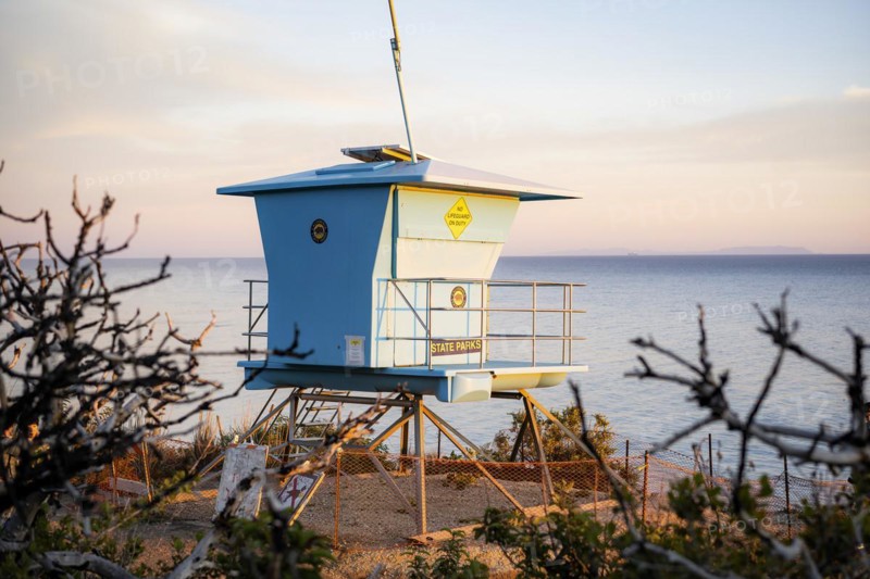 A lifeguard tower at sunset in El Matador Beach