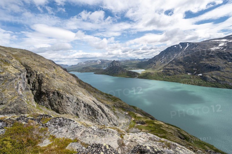 View of Lake Gjende behind Knutshoe Mountain withLake Ovre Leirungen