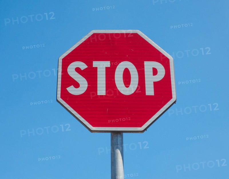 Stop sign over blue sky
