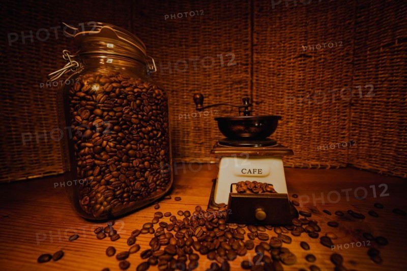 Jar with coffee beans on the wooden table
