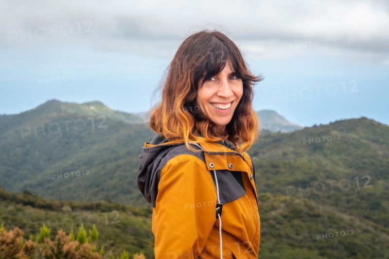 Woman smiling after finishing trekking on top of Garajonay in La Gomera