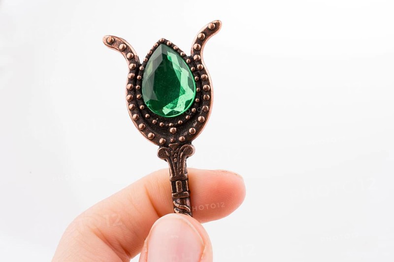 Hand holding a Retro styled teaspoon