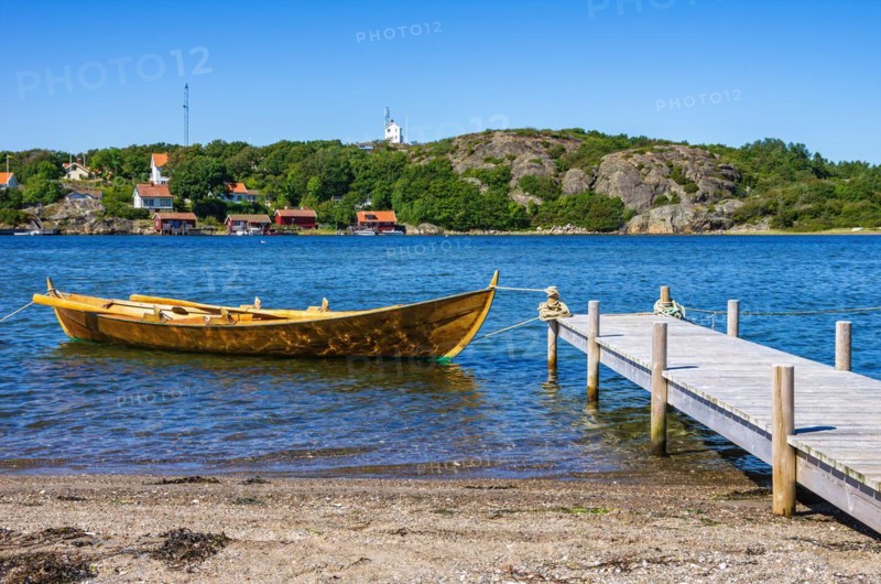 Single rowing boat at a jetty on the north beach of the South Koster Island