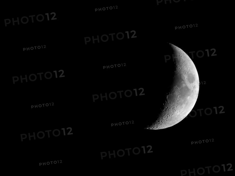 Waxing crescent moon seen with telescope