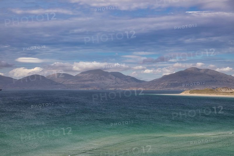 Coastline with sandy beach and mountains