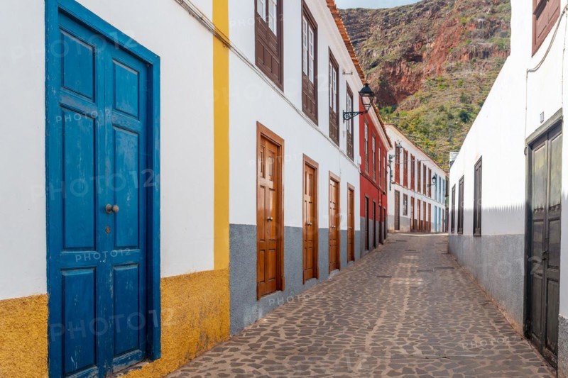Colored doors and windows to the streets in the village of Agulo in the north of La Gomera in summer