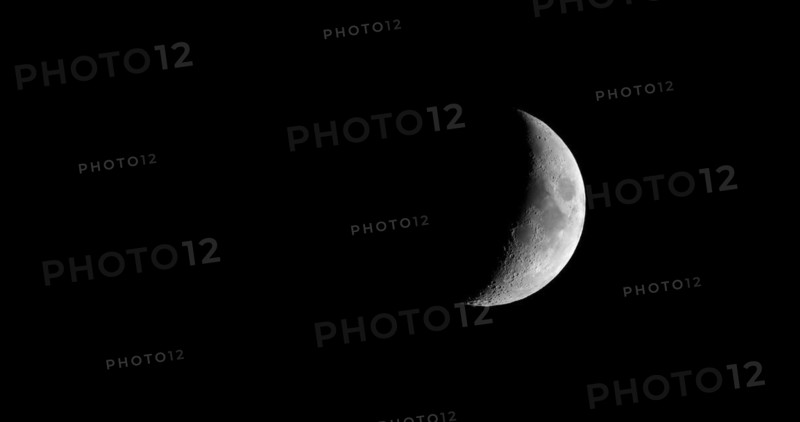 Waxing crescent moon seen with telescope