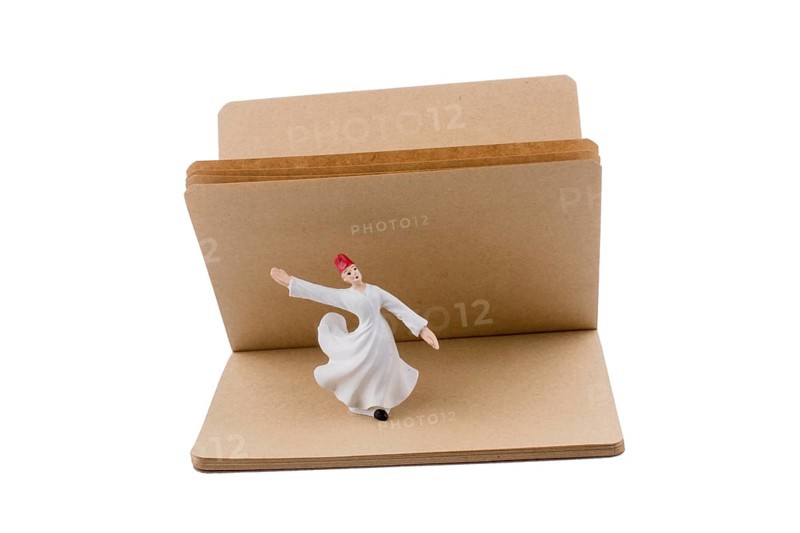 Sufi Dervish on a notebook on white background