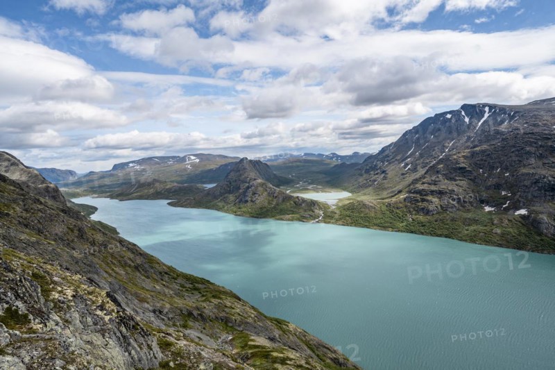 View of Lake Gjende behind Knutshoe Mountain withLake Ovre Leirungen