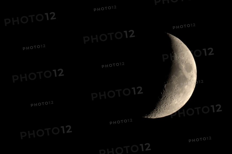 Waxing crescent moon seen with telescope