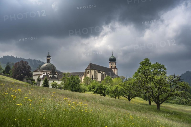 Thunderclouds pass over the Muenstertal and the monastery of Sankt Trudpert