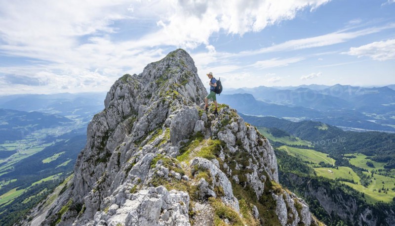 Mountaineer on a narrow ridge path