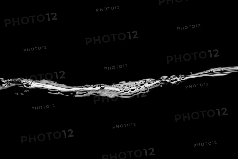 Released sweeping water surface with waves and eddies on a black background