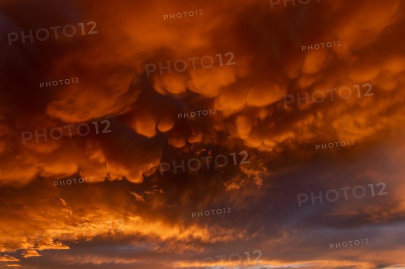 Inflamed sky with mammatus clouds at sunset. Saintes Maries de la Mer