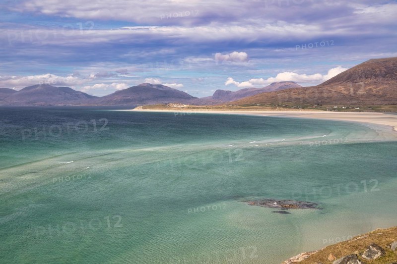 Coastline with sandy beach and mountains