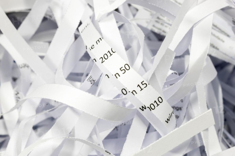 Paper strip documents made unrecognisable in the shredder