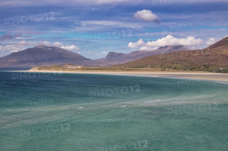 Coastline with sandy beach and mountains