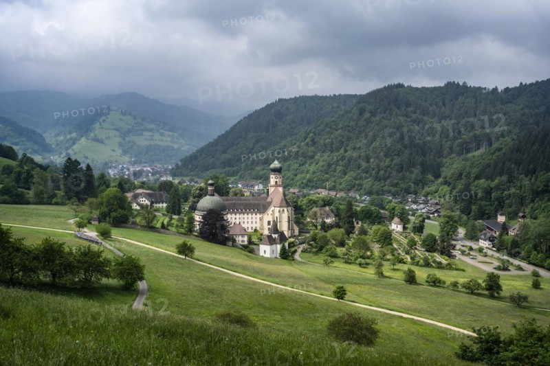 Thunderclouds pass over the Muenstertal and the monastery of Sankt Trudpert