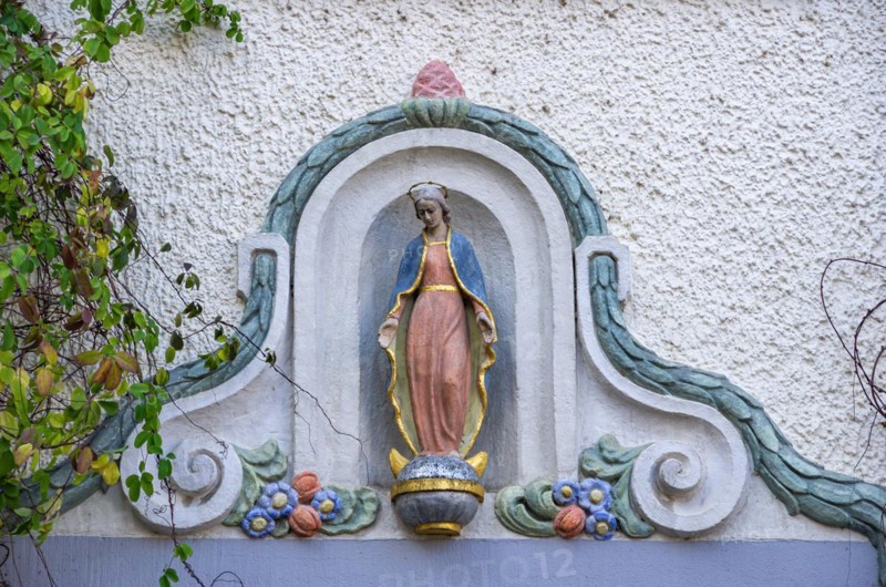 Madonna figure on a historical building in the old town