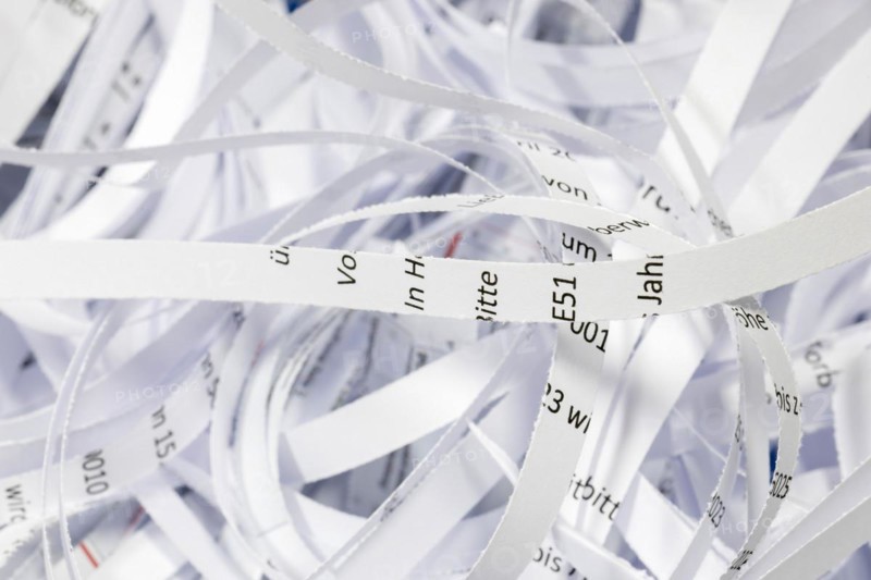 Paper strip documents made unrecognisable in the shredder