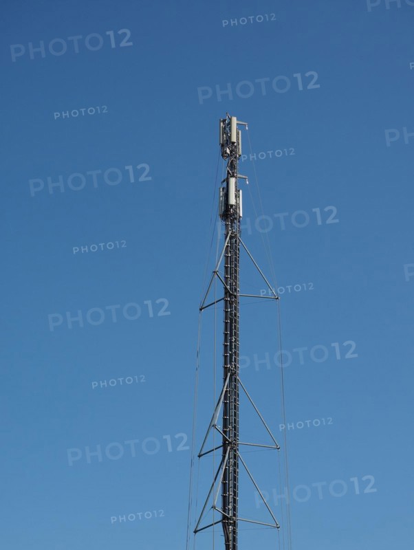 Aerial antenna tower over blue sky