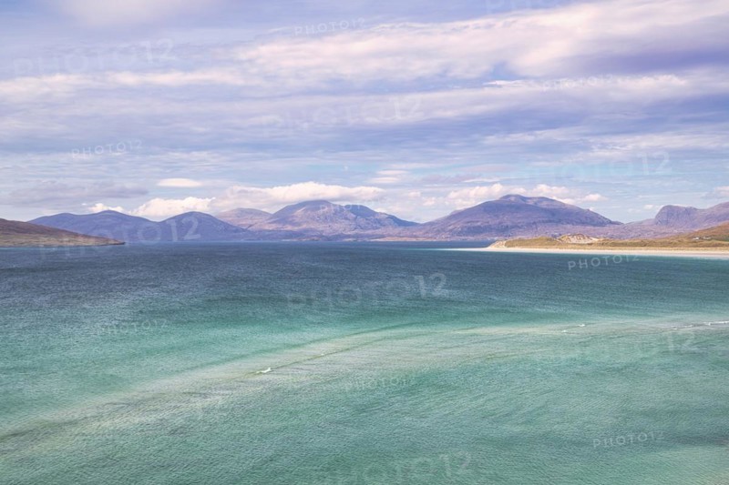 Coastline with sandy beach and mountains