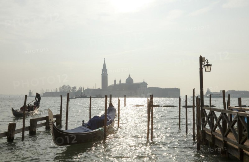 Moored gondolas at the Bacino di San Marco with the church of San Giorgio Maggiore