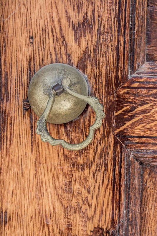Old Handmade ottoman door knob on wood