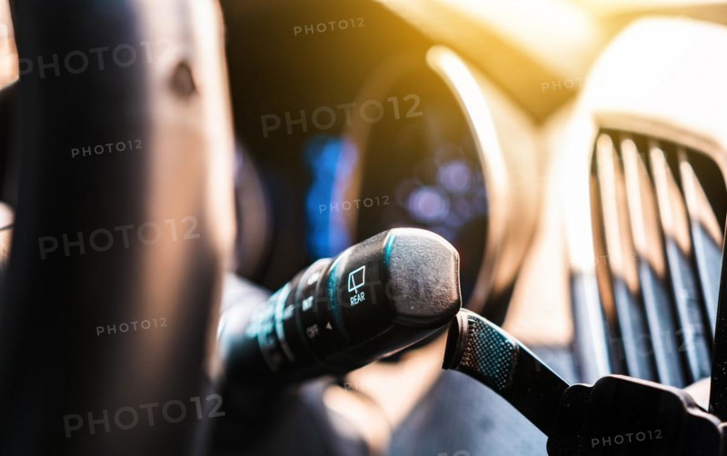 Car wiper control switch. Close-up of control lever for windshield wipers and washers of a car