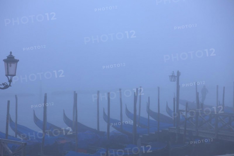Moored gondolas at the Bacino di San Marco in the fog