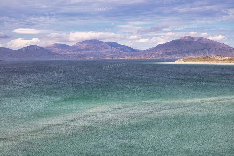 Coastline with sandy beach and mountains