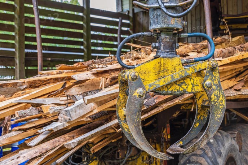 Machine Crane on a forestry vehicle forwarder to lifting logs