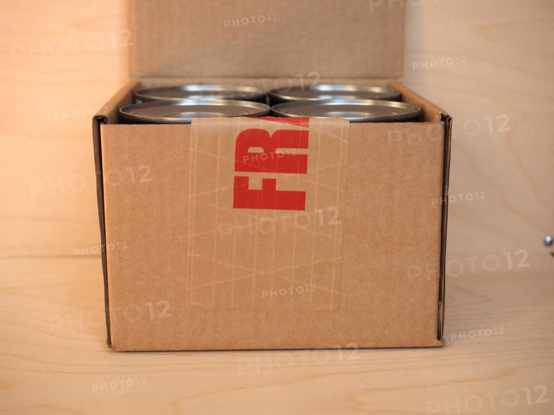 Fragile cardboard box with tin cans
