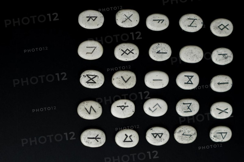 All viking stone runes on a black background fortune teller nordic mythology