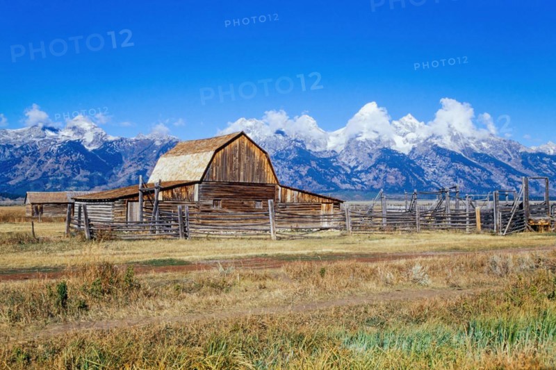 Old farm in the countryside by the rocky mountain at Grand Teton National Park in autumn