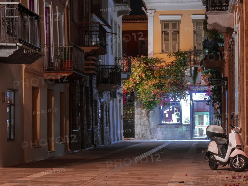 View of a narrow street and cafe in Nafplio