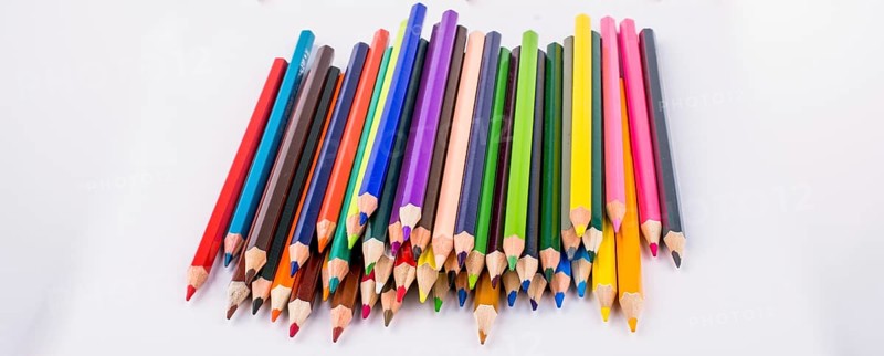 Color pencils and back to school title on a notebook