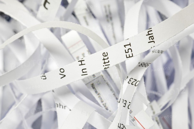 Paper strip documents made unrecognisable in the shredder