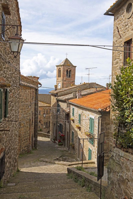 Medieval alley and clock tower