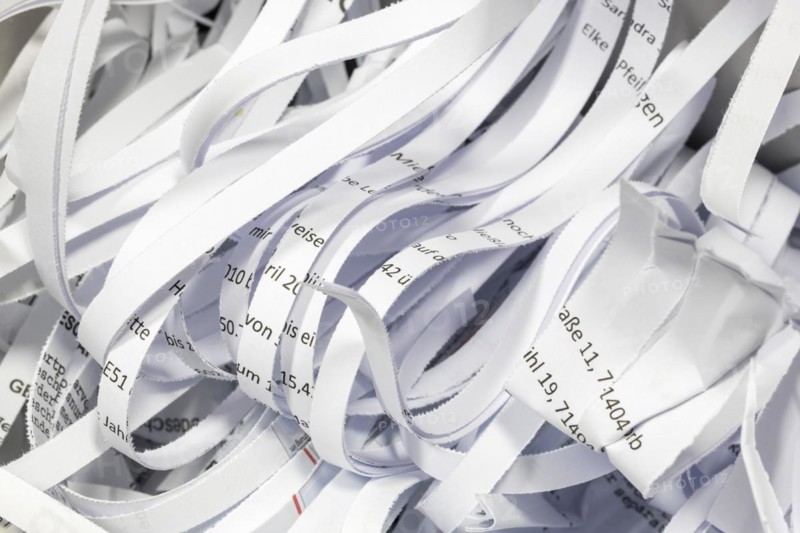 Paper strip documents made unrecognisable in the shredder