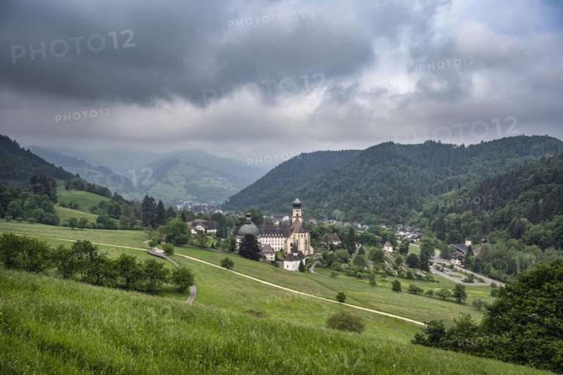 Thunderclouds pass over the Muenstertal and the monastery of Sankt Trudpert