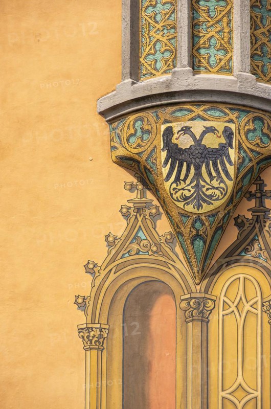Bay window with fresco of a coat of arms with double-headed eagle on the south-east corner of the historic