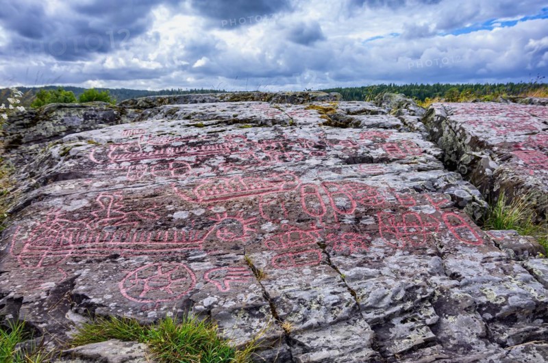 Picturesque view over the landscape and rocks of the Bronze Age rock carvings