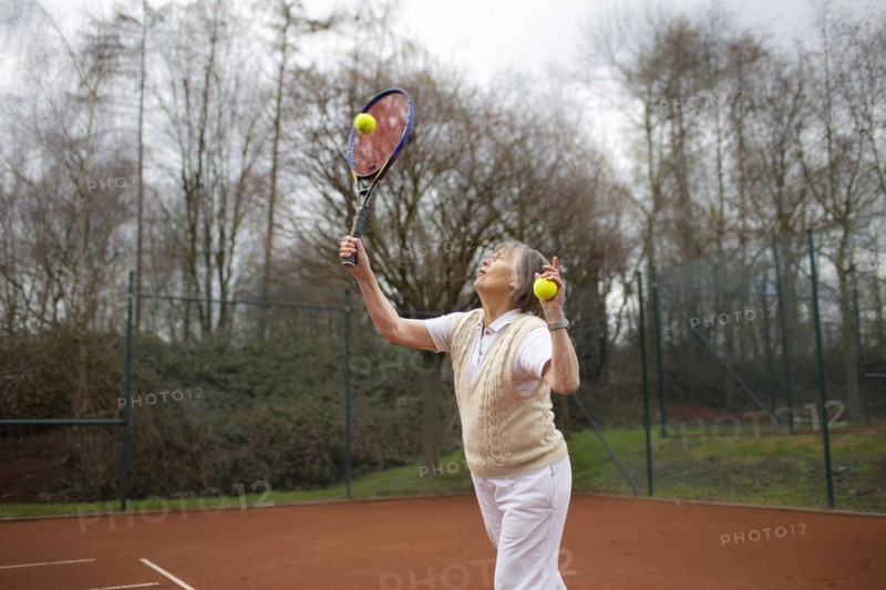 Subject: Woman aged 83 standing on the tennis court.