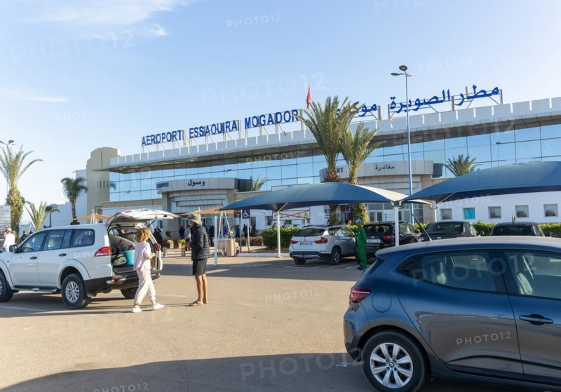 Cars parked outside airport terminal building