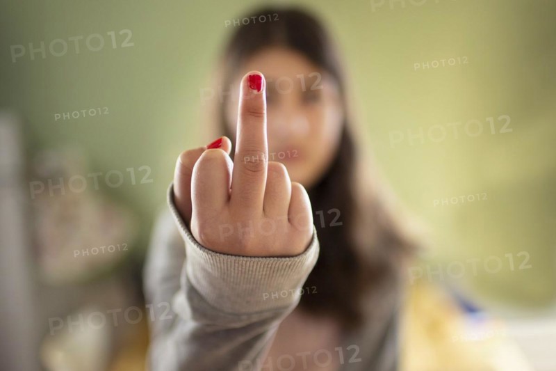 Topic: Girl shows middle finger in protest